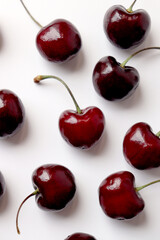 Red cherries are arranged irregularly.