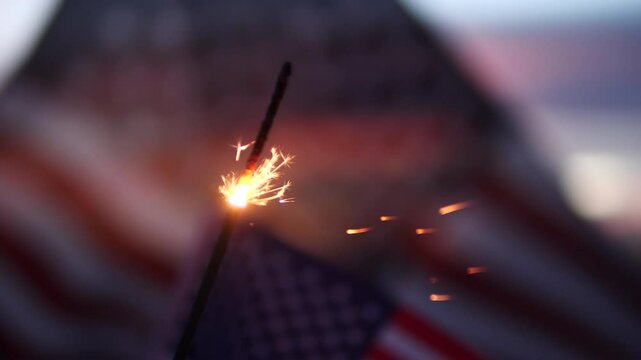 Happy 4th of July, Independence Day, sparklers, Fireworks Celebration. USA American flag waving sunset outdoor dark background. Concept fourth of July, 4th of July, USA, Freedom, Independence Day