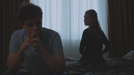 couple quarreling concept of family relationship problems divorce, black silhouette of man and woman sitting at bed back to back resentment towards each other window in dark room. guy cheated on girl - Powered by Adobe