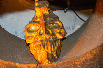 Grotesque Skull Sculpture in Warm Lighting