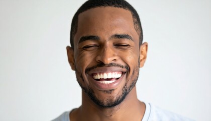 Obraz premium Joyful man laughs, eyes closed