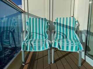 North Pacific Ocean, Alaska to Hawaii - Vacation Vibes: Empty Lounge Chairs with Towels on a Sunny...