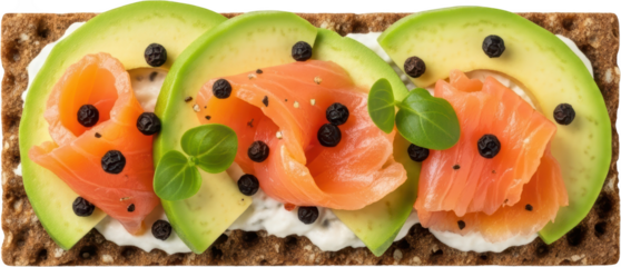 Crispbread with smoked salmon avocado slices cream cheese black pepper and basil leaf garnish