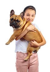 A girl holds a funny French bulldog in her arms.