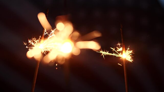 Happy 4th of July, Independence Day, sparklers, Fireworks Celebration. USA American flag waving sunset outdoor dark background. Concept fourth of July, 4th of July, USA, Freedom, Independence Day
