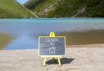 Learn to say no symbol. Concept words phrase Learn to say no on beautiful black blackboard....