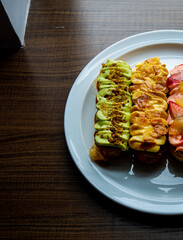 Assorted Gourmet Eclairs from the Sunday market.
