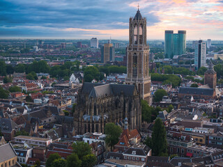 Aerial view of Utrecht, Netherlands, highlighting the Gothic Dom Tower, historic buildings, modern...