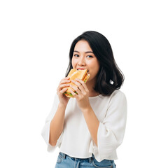 young woman eating a sandwich
