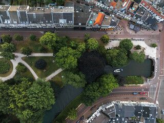 Aerial image of a park in Utrecht, Netherlands, with walking paths, a canal with a small boat, and...
