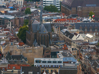 Aerial view of Utrecht, Netherlands, featuring a Gothic style church with a tall spire, traditional...