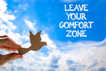 Leave your comfort zone symbol. Concept words Leave your comfort zone on beautiful blue sky....