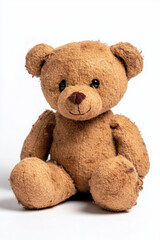 Soft plush teddy bear with brown fur sitting upright, isolated on white background.