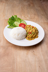  fried chicken, curry powder over rice with vegetable  