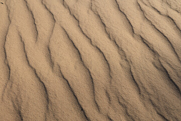 Fototapeta premium Texture of sand and earth, sand dunes and mountains