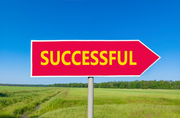 Successful symbol. Concept word Successful on beautiful red road sign. Beautiful blue sky green grass and forest peaceful nature background. Business successful concept. Copy space.