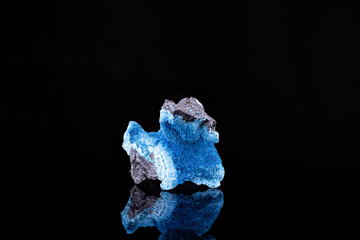 Blue Shattuckite. Specimen from Mesopotamia Farm 504, Namibia. photography isolated on black background. macro detail close-up mineral crystal unpolished semi-precious gemstone.
