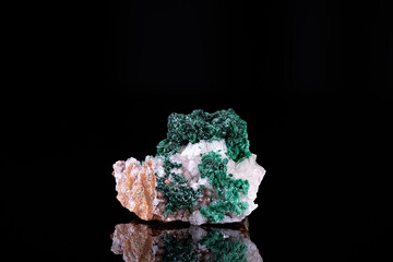 green Malachite on white Calcite. Specimen from Tsumeb mine, Namibia. photography isolated on black background. macro detail close-up mineral crystal unpolished semi-precious gemstone.
