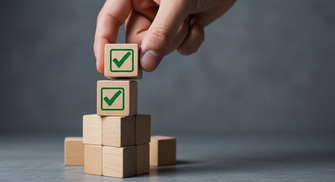 Human hand placing wooden cube with green check mark on blocks, symbolizing checklist, survey, and assessment process on gray background. AI generated