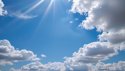 a serene day with a blue sky, dotted with white clouds. sunlight filters through the clouds, casting an inviting glow across the expansive expanse of the sky.
