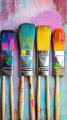 Fototapeta premium Vibrant Paint Brushes on Colorful Artistic Background