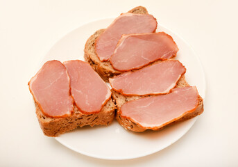 Ham sandwiches. Ham cut into thin slices.