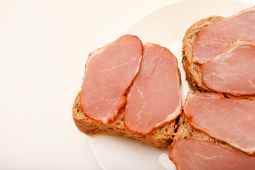 Ham sandwiches. Ham cut into thin slices.