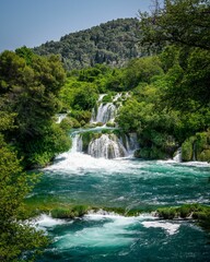 Lush waterfall and turquoise river landscape