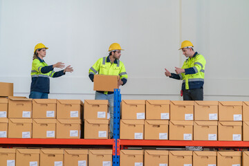 Warehouse worker working in warehouse storage. Foreman or worker work at factory site check up...