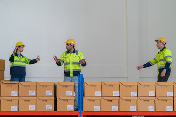 Warehouse worker working in warehouse storage. Foreman or worker work at factory site check up...