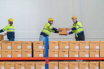 Warehouse worker working in warehouse storage. Foreman or worker work at factory site check up...