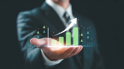 Businessman analyzes financial data with digital tablet pointing to growing bar graph, symbolizing investment success and market growth within a dynamic environment.