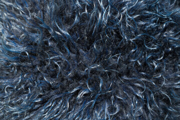 Closeup detail of navy blues fake fur rug