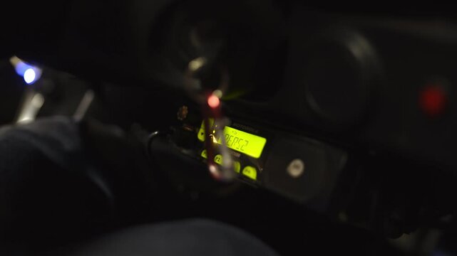 Close-up of Two-Way Radio/CB Radio in Dark Car Dashboard