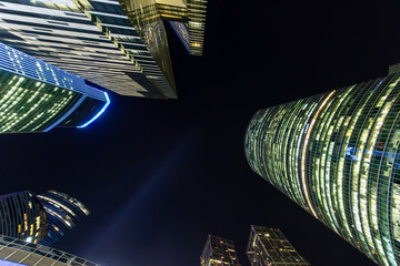 Modern high glass skyscrapers in the night