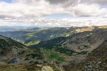 Fototapeta premium mountain landscape with clouds carpathians with lakes down