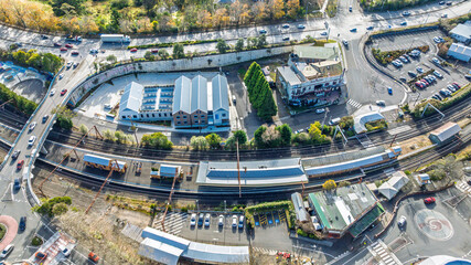 Drone aerial photograph of the Train Station in Katoomba with passengers waiting for the next train to arrive near the Great Western Highway in the Blue Mountains, NSW, Australia.