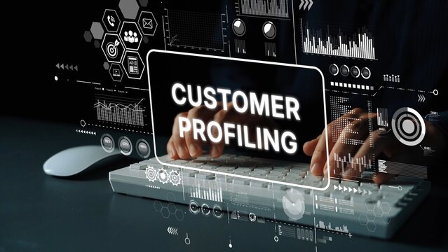 Hands typing on a keyboard with customer profiling data overlayed on modern digital interface in a professional environment. Asymptotic smart data analytic.