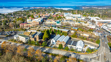 Drone aerial photograph of the picturesque and tourism town of Katoomba and the Jamison Valley full of low level clouds in the Blue Mountains, NSW, Australia.