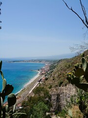 View of the Ionian Sea coast at Taormina town, Sicily, Mediterranean Sea coast. Italy