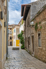 Historic Mediterranean stone street architecture colorful buildings in Porec, Croatia.