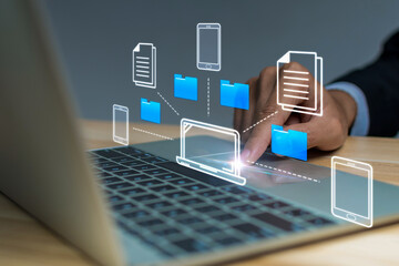 Document Management System. business man using automation software application manage file folder on laptop computer, artificial intelligence, file transfer, cloud computing technology concept