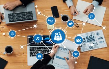 A dynamic workspace showcasing a collaborative meeting with technology tools, digital media...