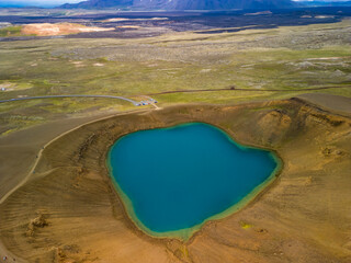 Aerial drone view of small volcanic Krafla lake with azure water, Iceland