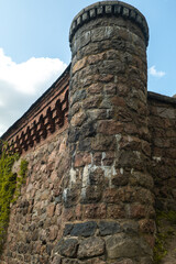 An Ancient Stone Tower Stands Majestically Against a Bright and Clear Blue Sky Above It