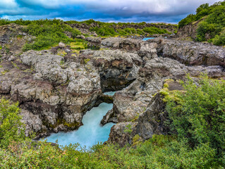 Aerial drone view of Barnafoss and Hraunfossars waterfall in west Iceland