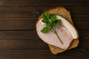 Rustic Open-Faced Sandwich with Smoked Ham and Parsley on Whole Grain Bread
