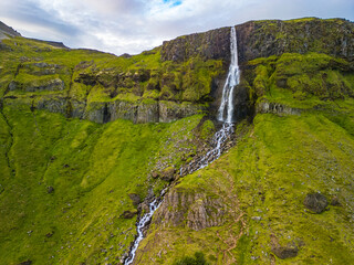 Aerial drone view of a waterfall Bjarnarfoss in Snaefellsnes Peninsula.