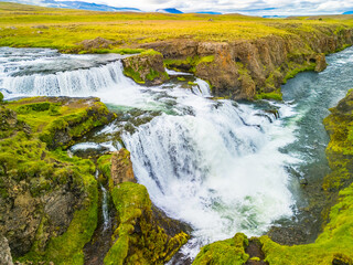 Aerial drone view of Fosslaug waterfall, Iceland