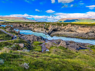 Godafoss waterfall with colorful sunset sky in summer at Iceland